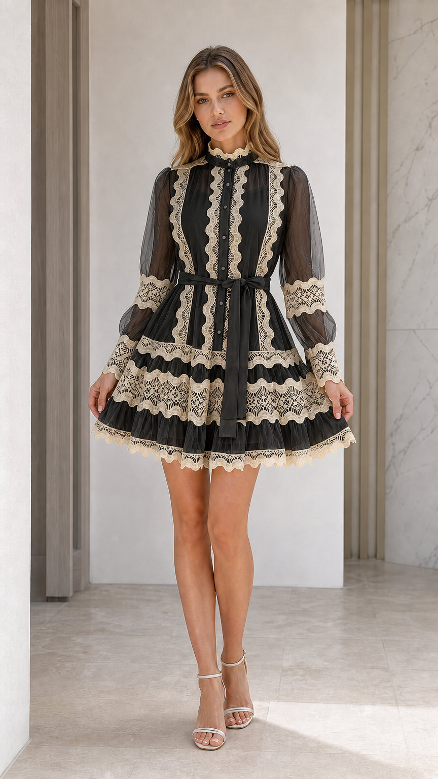 Front view of black mock neck mini dress with contrast beige lace trim