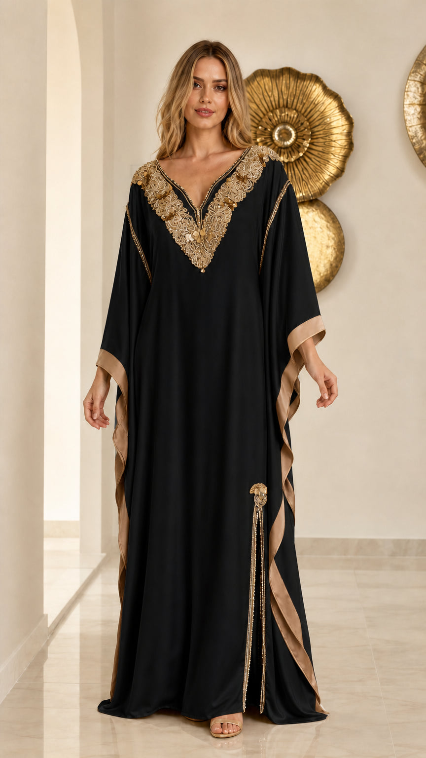 Front view of black embroidered kaftan maxi dress with gold accents