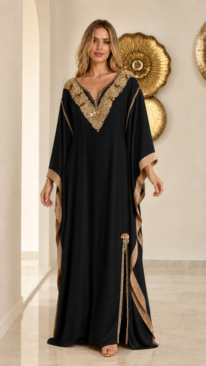 Front view of black embroidered kaftan maxi dress with gold accents