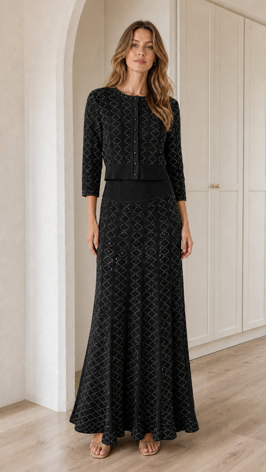 Model wearing Black pointelle knit cardigan and maxi skirt two-piece set