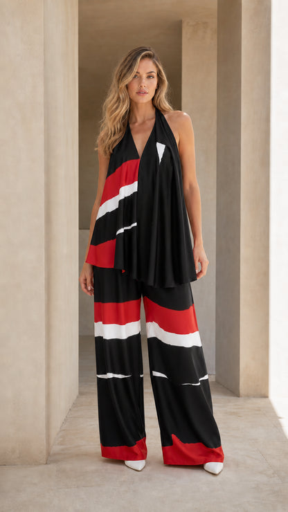 Full-length studio shot of black, red, and white color block halter two-piece set