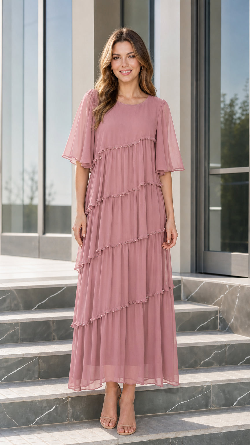 Front view of woman wearing dusty rose tiered chiffon maxi dress
