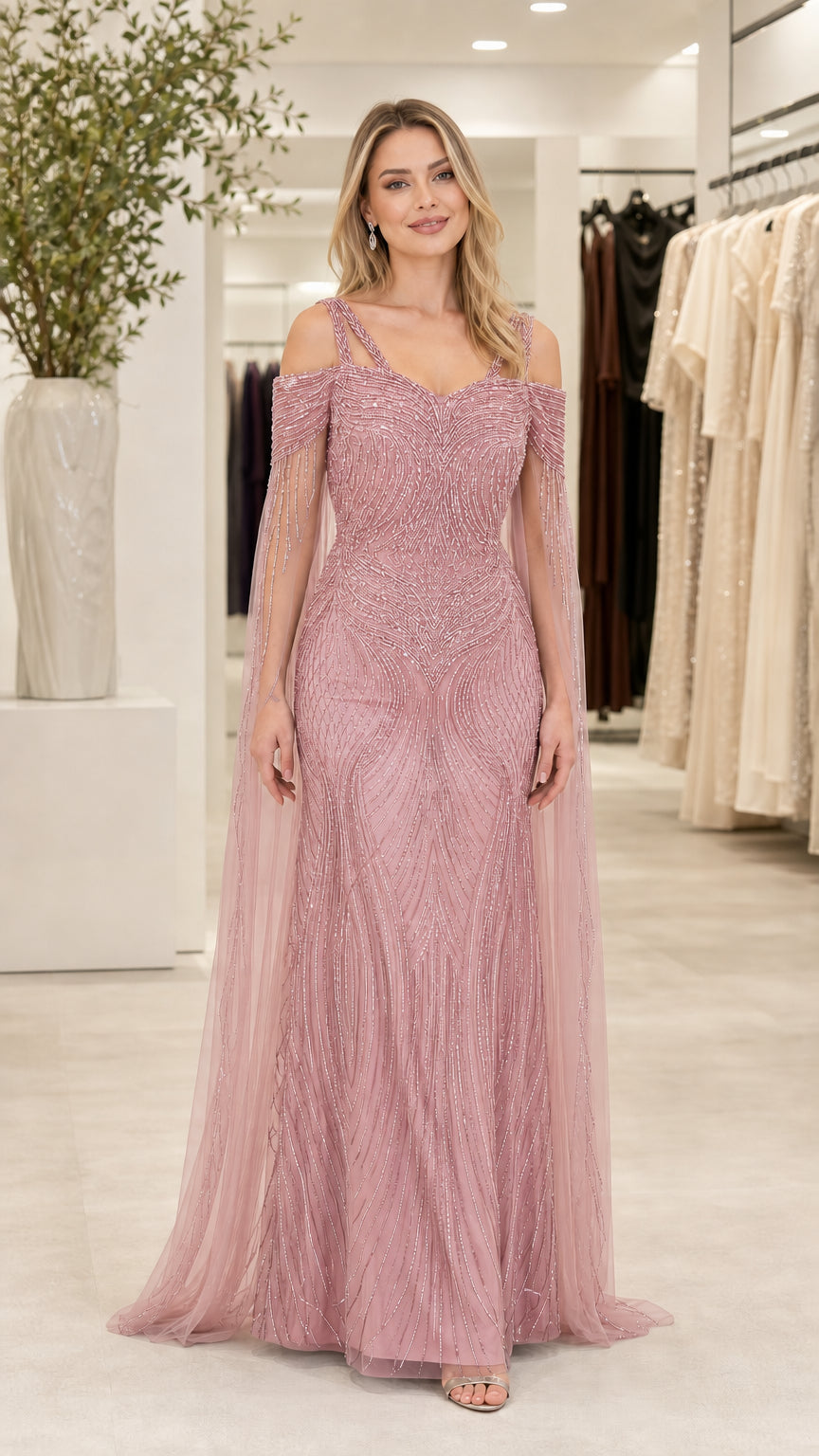 Front view of dusty rose pink beaded formal maxi gown with cape sleeves