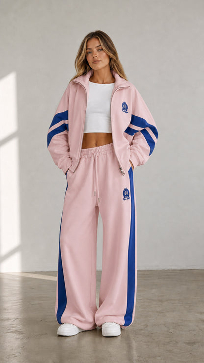 Light pink women's two-piece tracksuit set with blue contrast stripe details