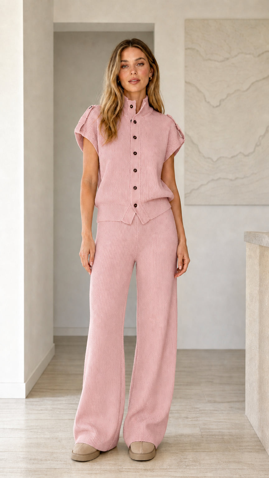 Front view of model wearing dusty pink ribbed knit button top and wide leg pants set
