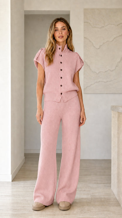Front view of model wearing dusty pink ribbed knit button top and wide leg pants set