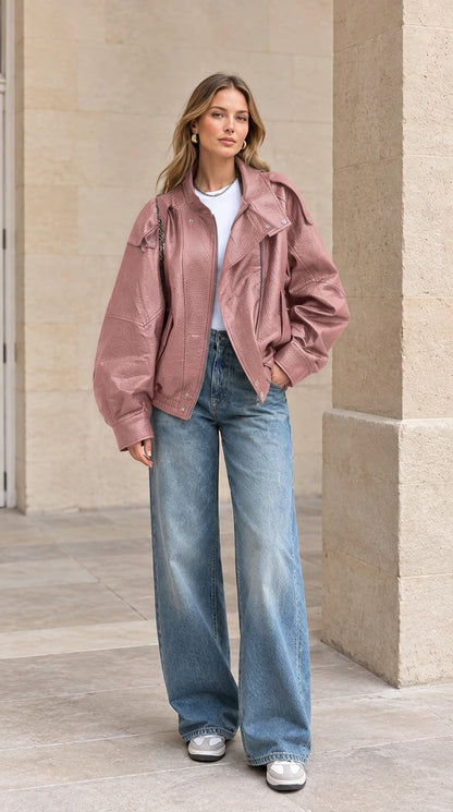 Front view of woman wearing dusty rose pink textured faux leather bomber jacket