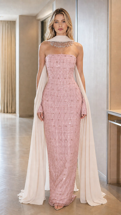 Front view of the Dusty Pink strapless beaded maxi gown with flowing chiffon cape