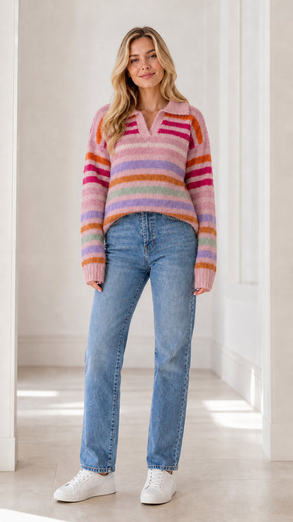 Front full view of woman wearing pink base multicolor striped polo knit sweater