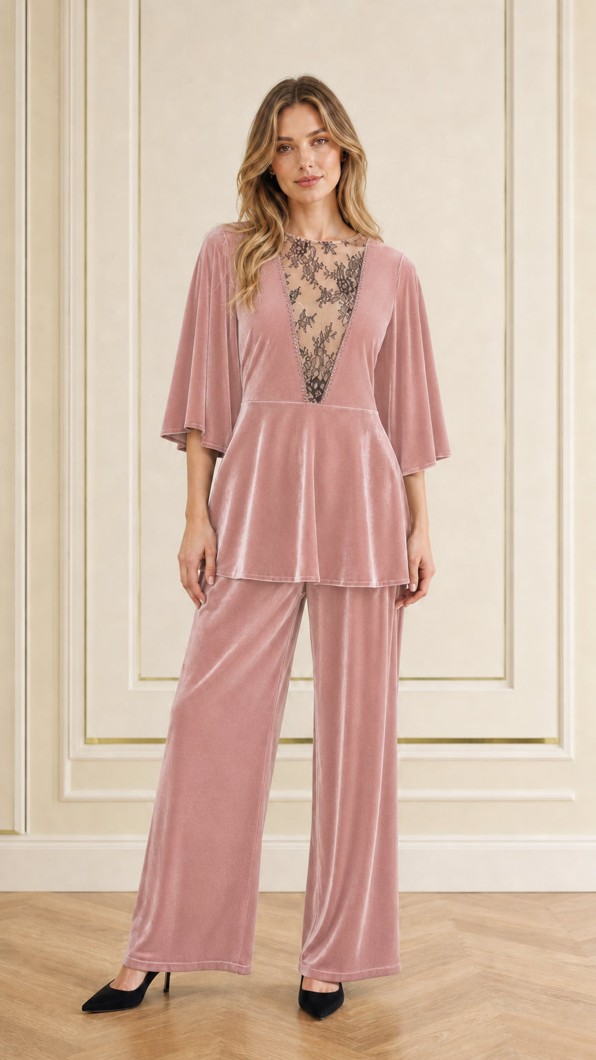Front view of woman wearing dusty rose pink velvet two-piece pant set