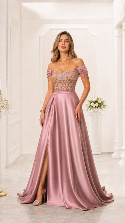 Model wearing dusty rose pink off-the-shoulder embroidered satin evening gown with slit