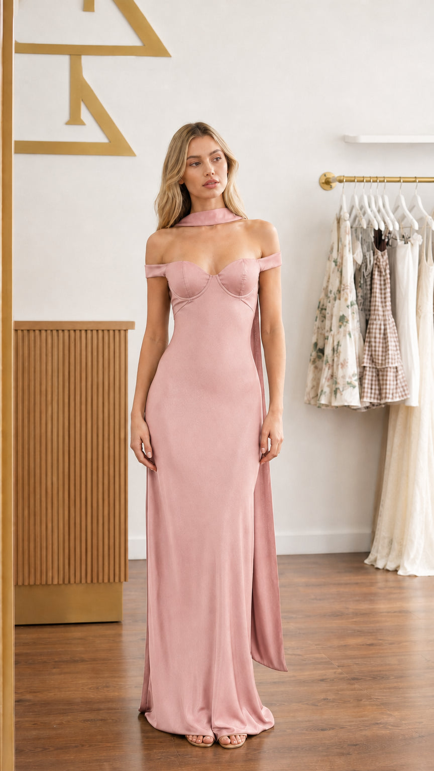 Model wearing blush pink satin off-shoulder bustier maxi dress - front view
