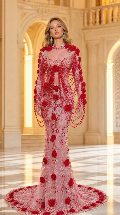 Model wearing Blush Pink beaded mermaid gown with red 3D floral appliqués and draped train