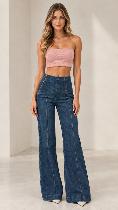 Model wearing Classic Blue high-rise flare jeans paired with pink crop top