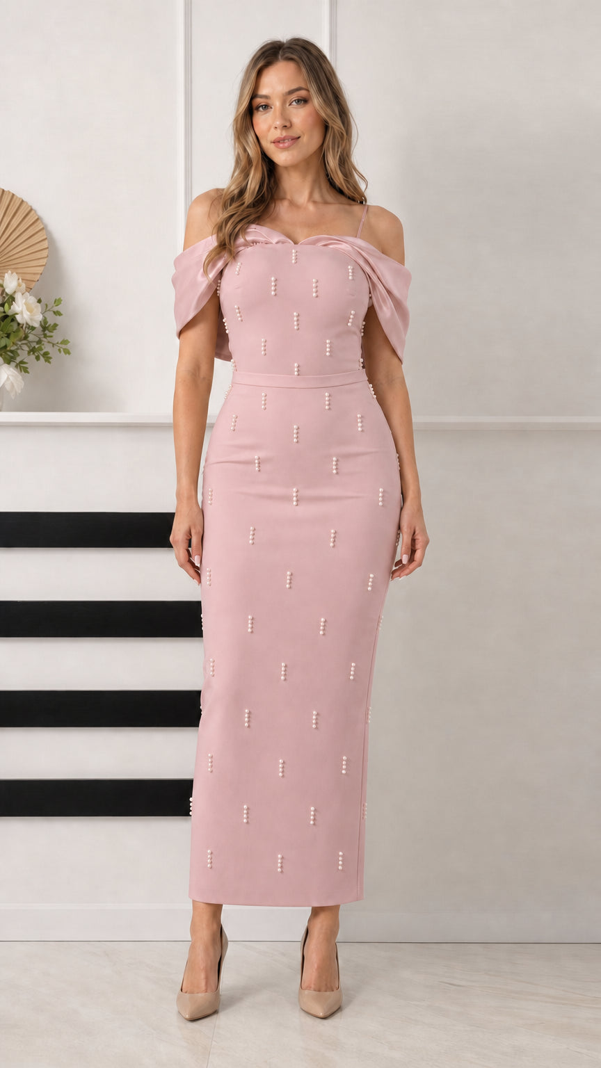 Front view of blush pink pearl-embellished off-the-shoulder column formal dress