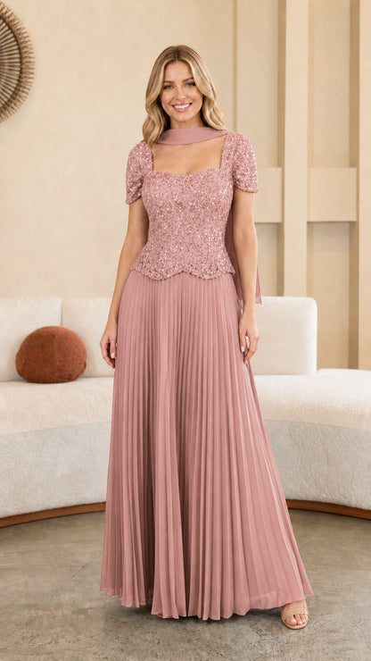 Model wearing Dusty Rose pink sequined bodice pleated maxi formal dress