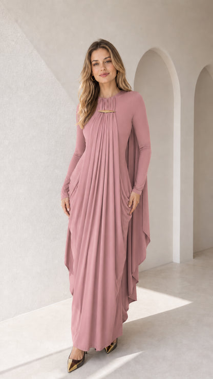 Full-length front view of dusty rose long sleeve pleated cape maxi dress