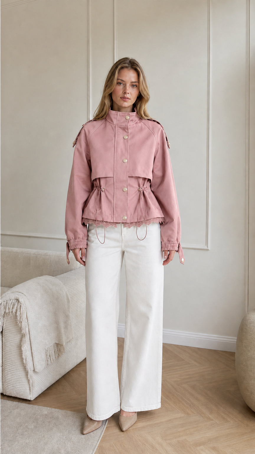 Model wearing dusty pink cropped utility jacket with lace trim