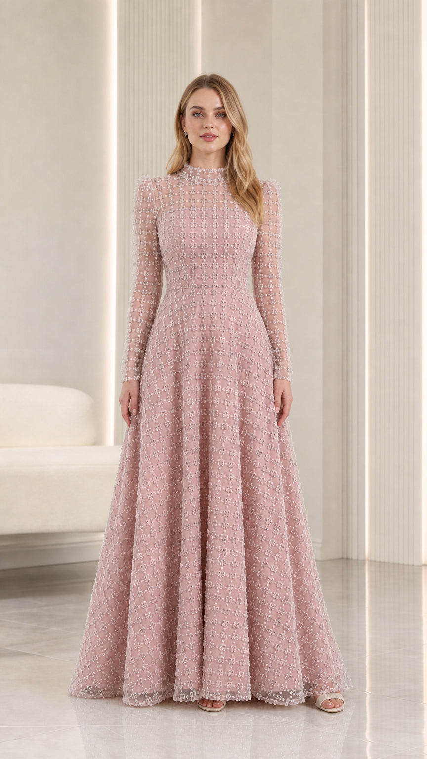 Full-length front view of blush pink embellished illusion high-neck maxi evening gown