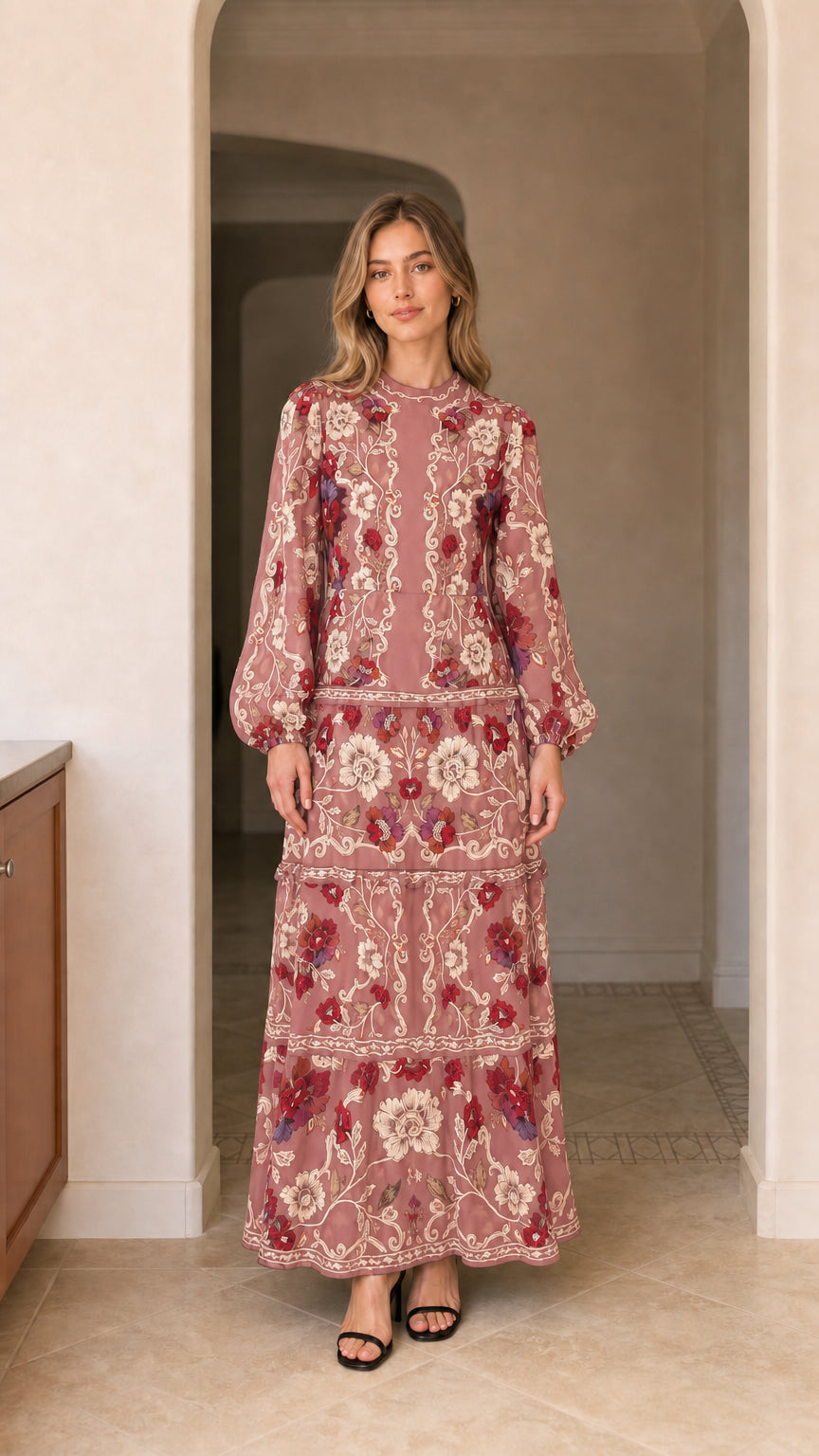 Model wearing long sleeve tiered floral maxi dress in dusty pink