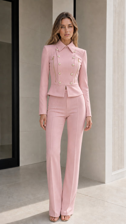Model wearing light pink double-breasted peplum blazer and flared pants suit set