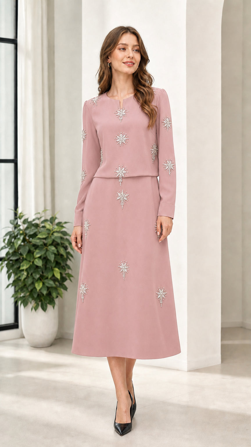 Dusty pink long sleeve rhinestone embellished midi dress on model