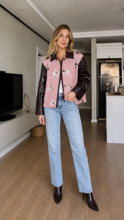 Full-body front view of model wearing dusty pink floral embroidered contrast sleeve jacket