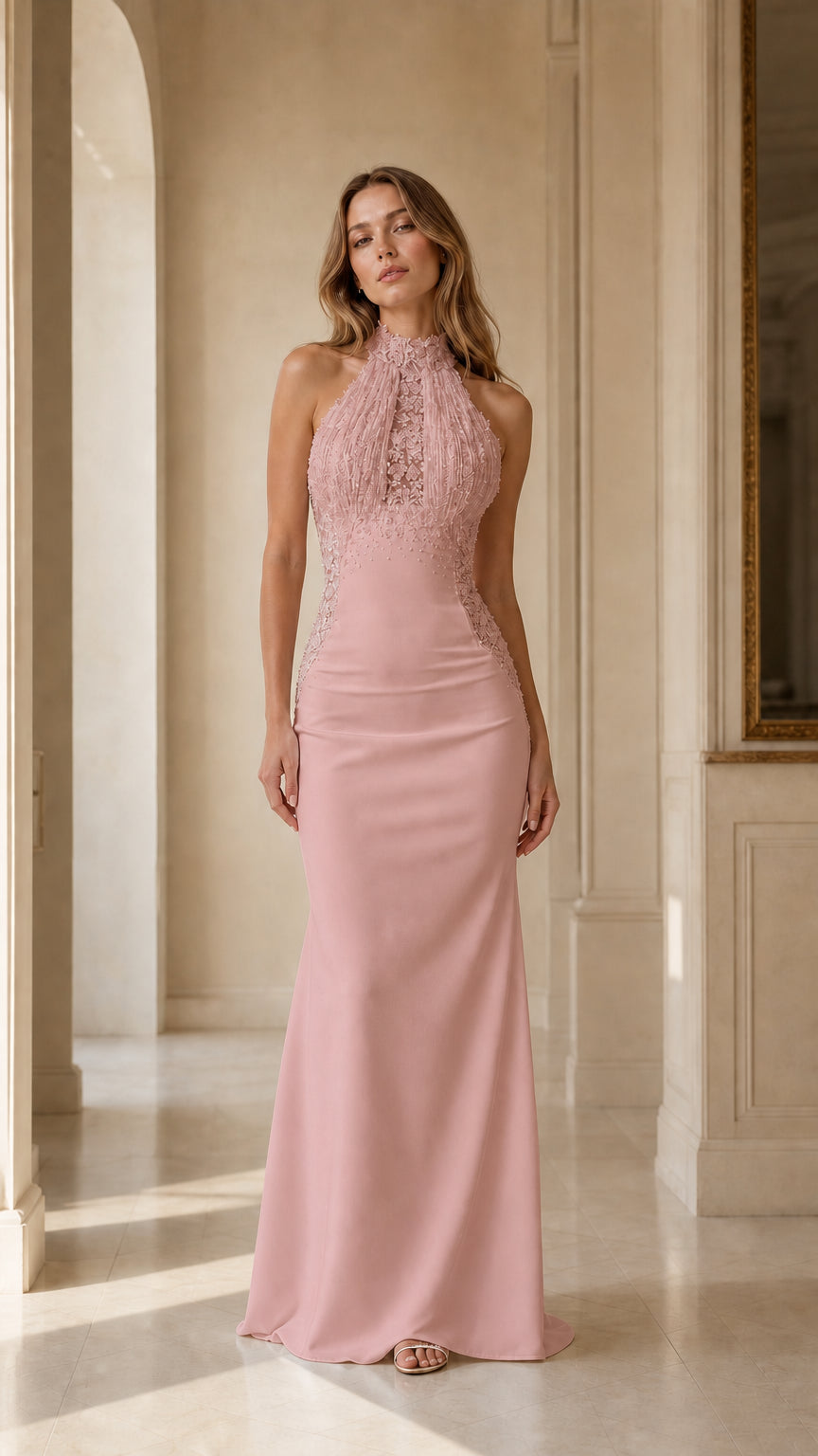 Front view of woman wearing blush pink halter beaded fringe mermaid evening gown