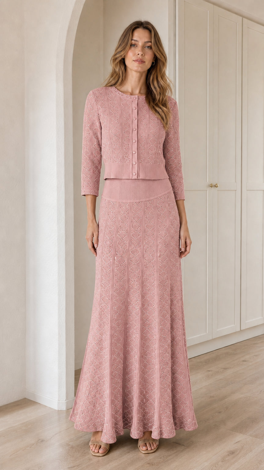 Model wearing Dusty Pink knit cardigan and flowing maxi skirt set
