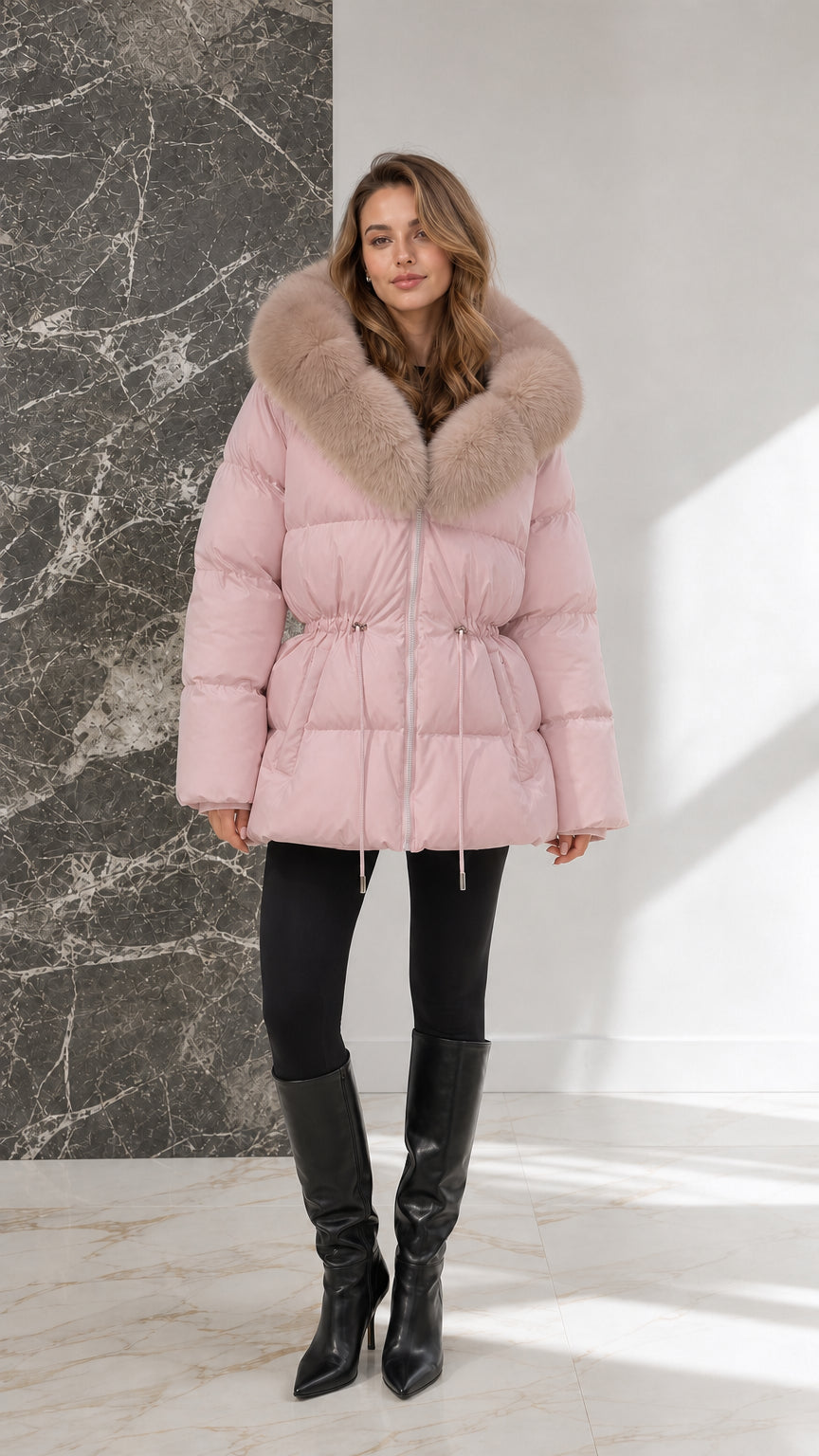 Full-body view of model wearing blush pink hooded puffer coat with drawstring waist