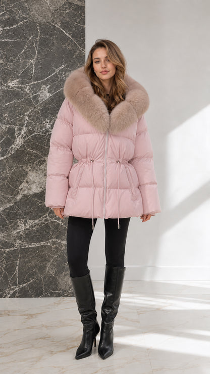 Full-body view of model wearing blush pink hooded puffer coat with drawstring waist