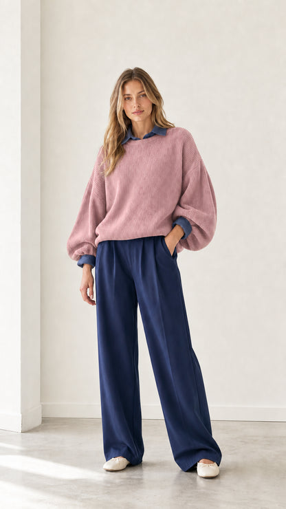 Model wearing dusty pink layered ribbed knit sweater with blue collar