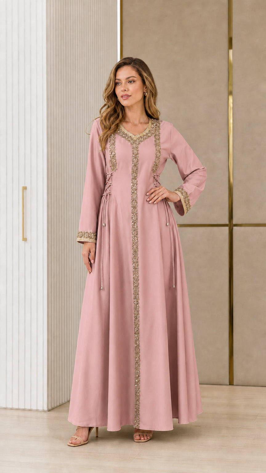 Model wearing dusty rose pink embroidered kaftan maxi dress