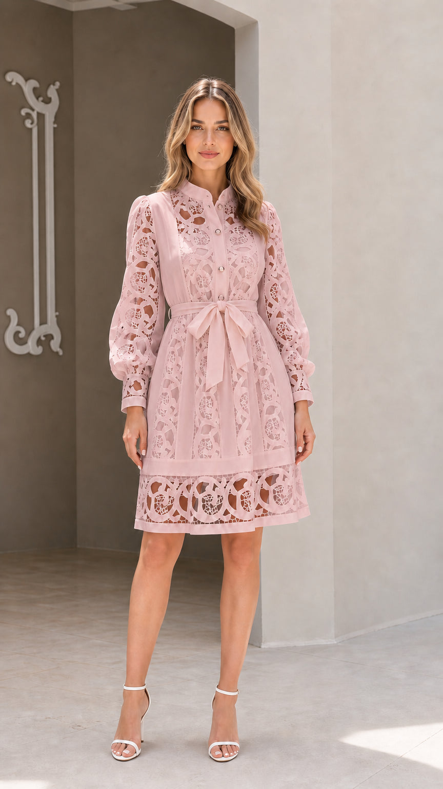 Model wearing blush pink long sleeve embroidered lace belted shirt dress