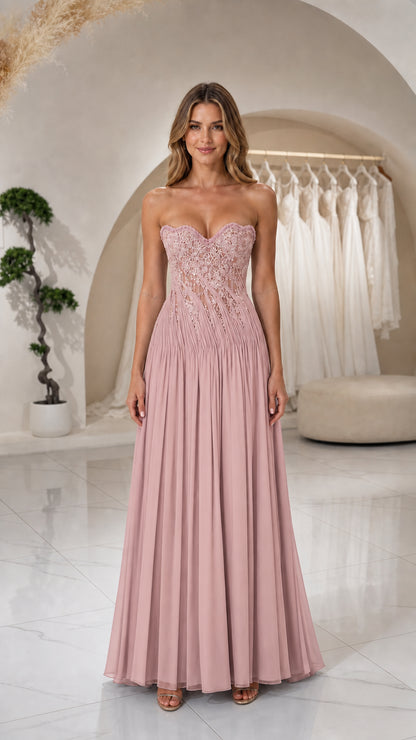 Front view of woman wearing Blush Pink strapless beaded corset pleated evening gown