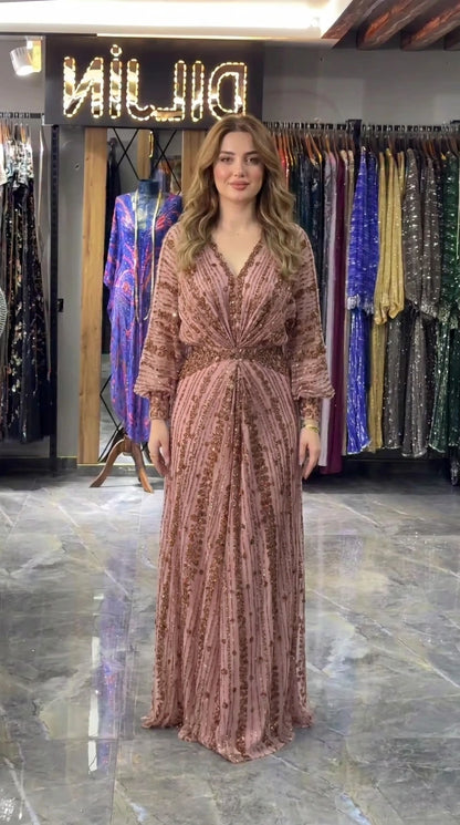 Dusty rose sequin embellished long-sleeve evening maxi dress on model