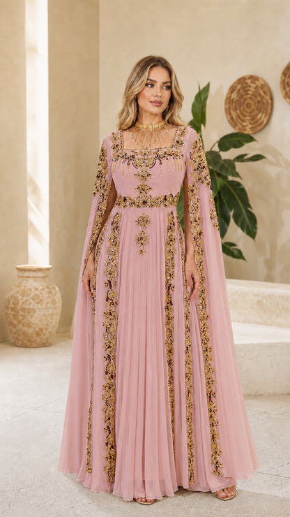 Model wearing dusty pink embellished cape sleeve maxi evening gown