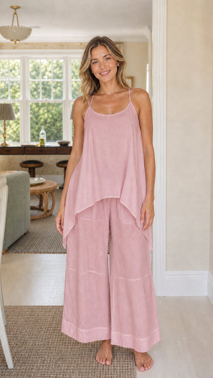 Front view of woman wearing dusty pink handkerchief top and wide leg pants set