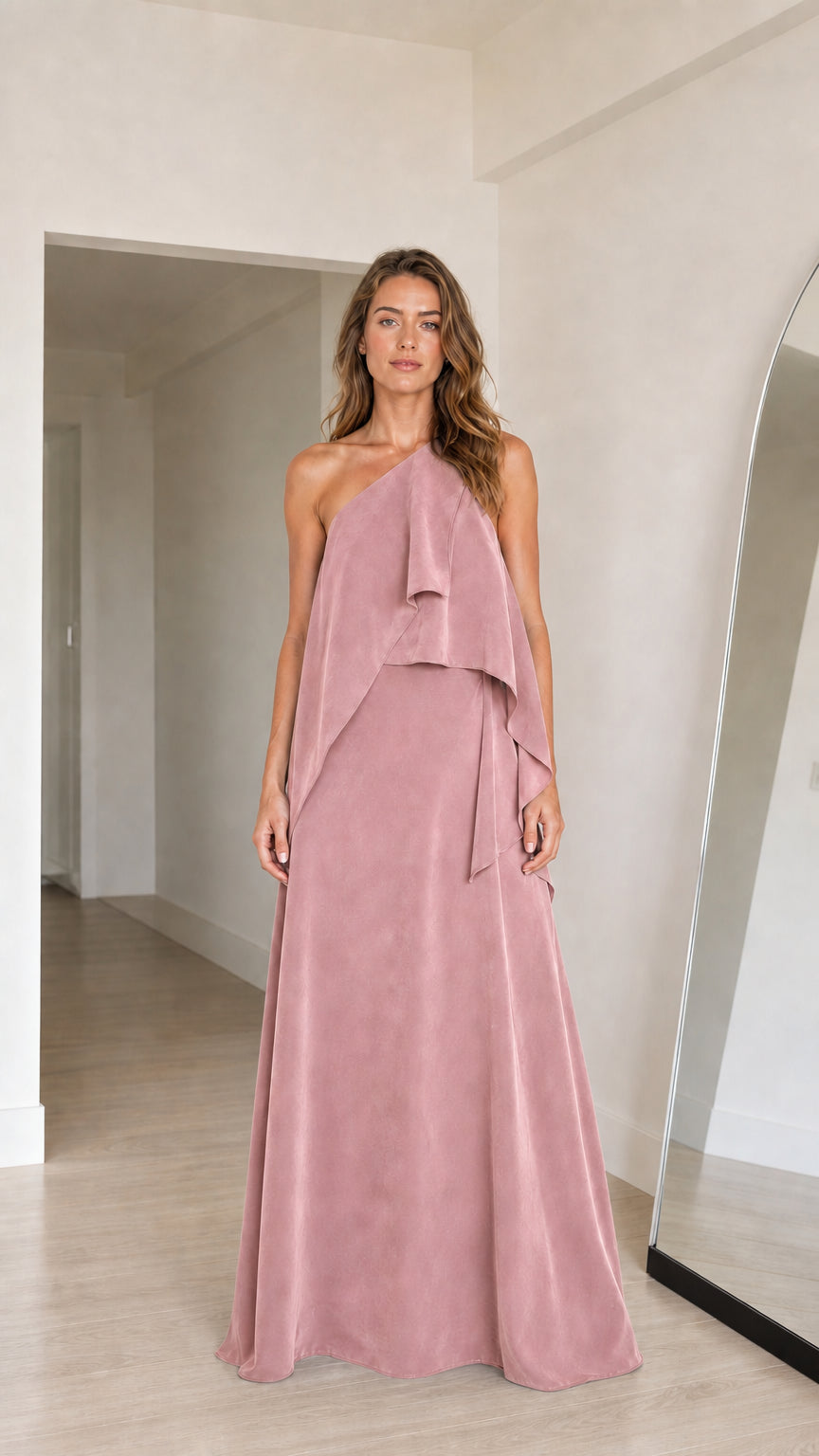 Model wearing dusty rose pink one-shoulder tiered maxi gown