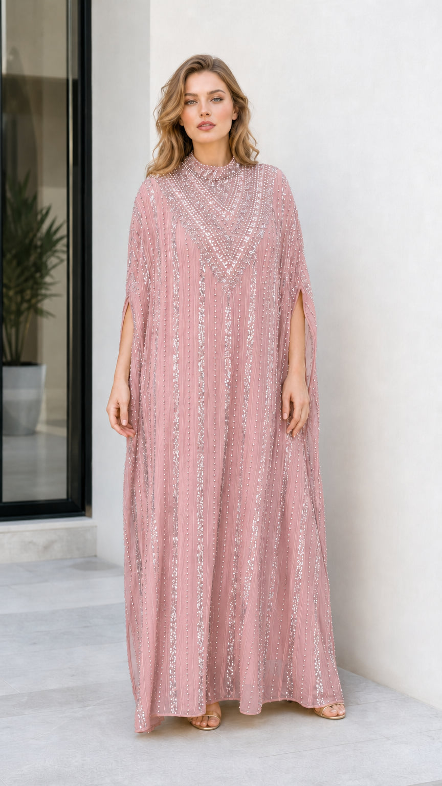 Model wearing dusty pink sequined cape sleeve kaftan maxi dress