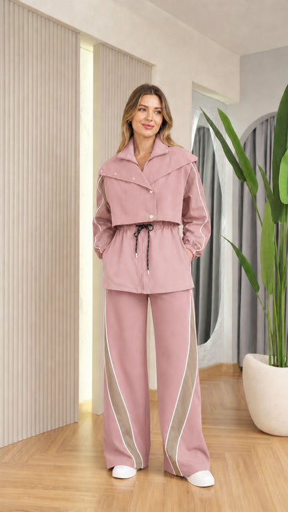 Front view of woman wearing dusty pink monochrome colorblock jacket and wide leg pants set