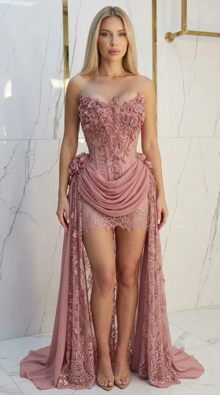 Model wearing dusty pink embellished corset gown with draped skirt train