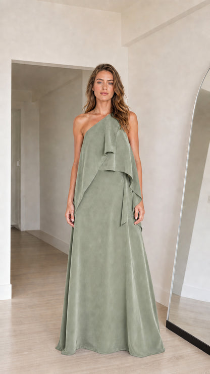 Model wearing sage green one-shoulder draped formal maxi dress