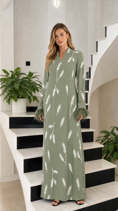 Front view of sage green embroidered long sleeve gown with feather cuffs