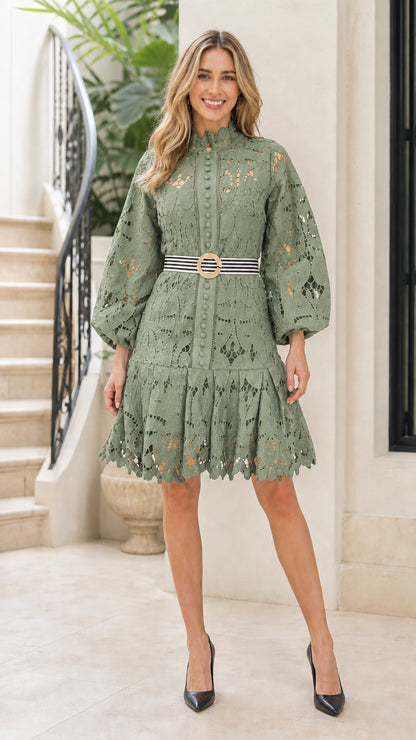 Front view of woman wearing sage green lace mini dress