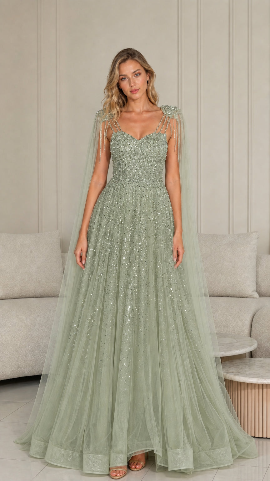 Sage green beaded tulle floor-length prom gown with shoulder drapes