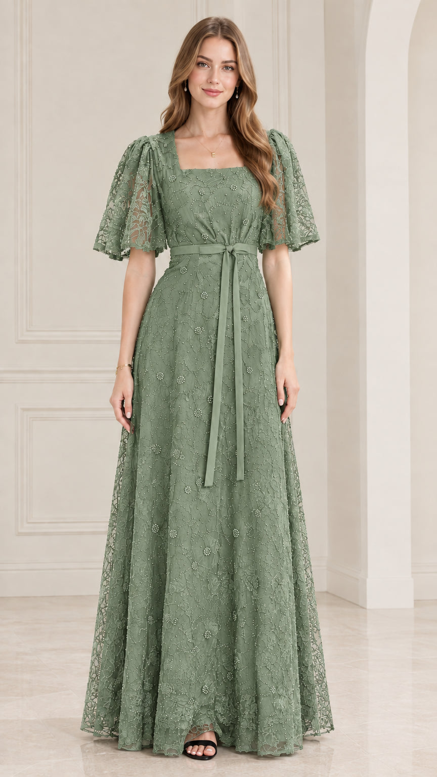 Front view of model wearing sage green embroidered lace evening dress