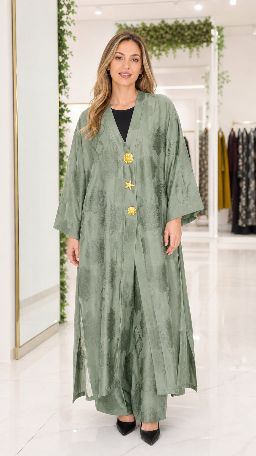 Front view of sage green jacquard maxi abaya with gold buttons