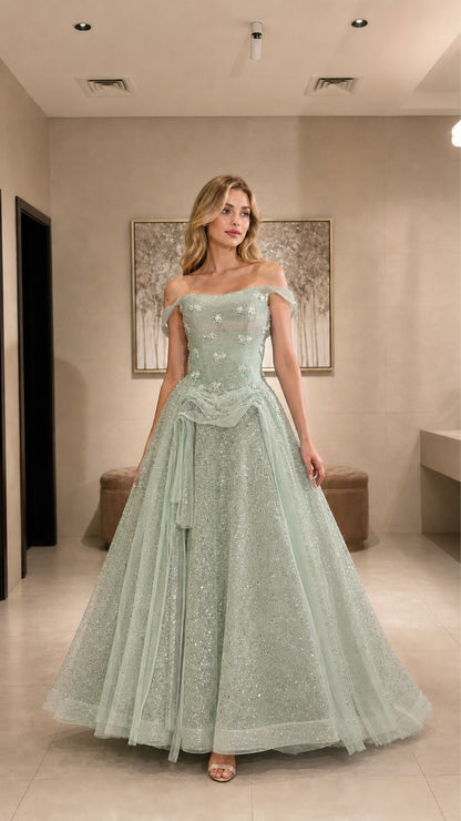 Model wearing sage green glitter tulle formal ball gown