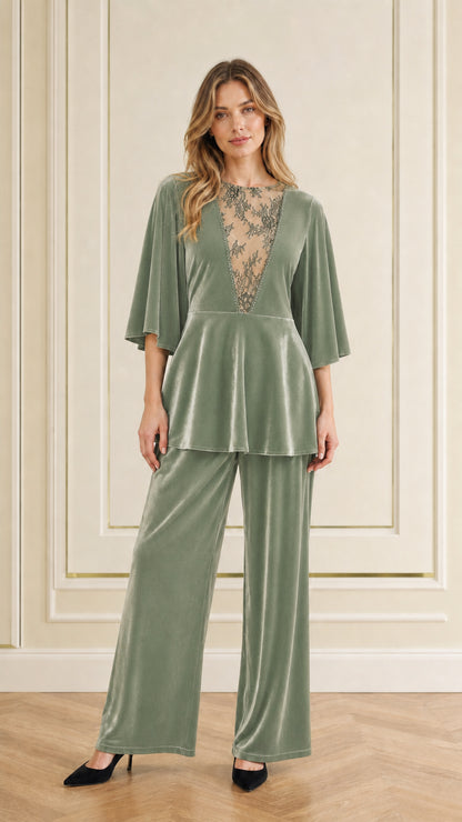 Front view of woman wearing sage green velvet two-piece pant set
